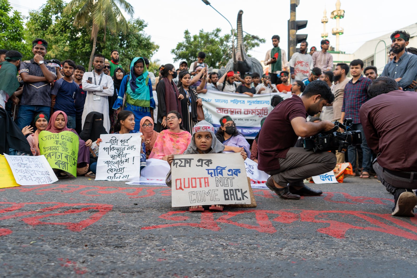 Young women and girls marching at the forefront of a protest