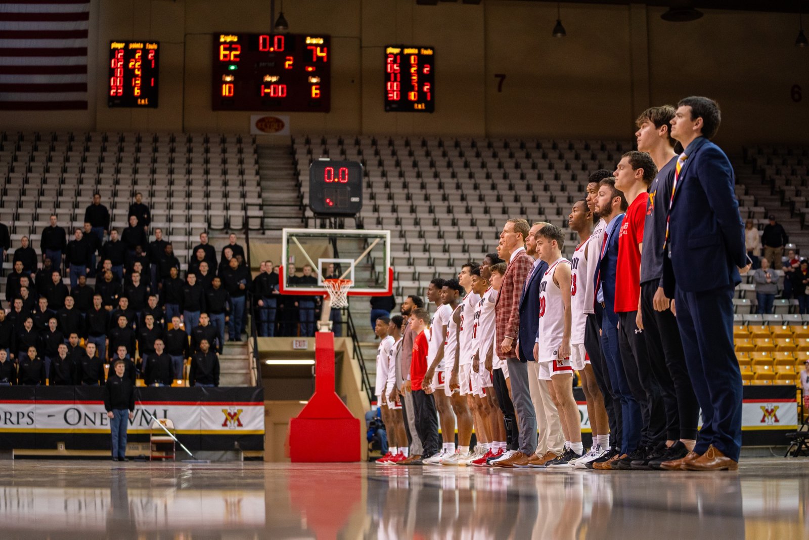 College basketball team lined up courtside before tipoff