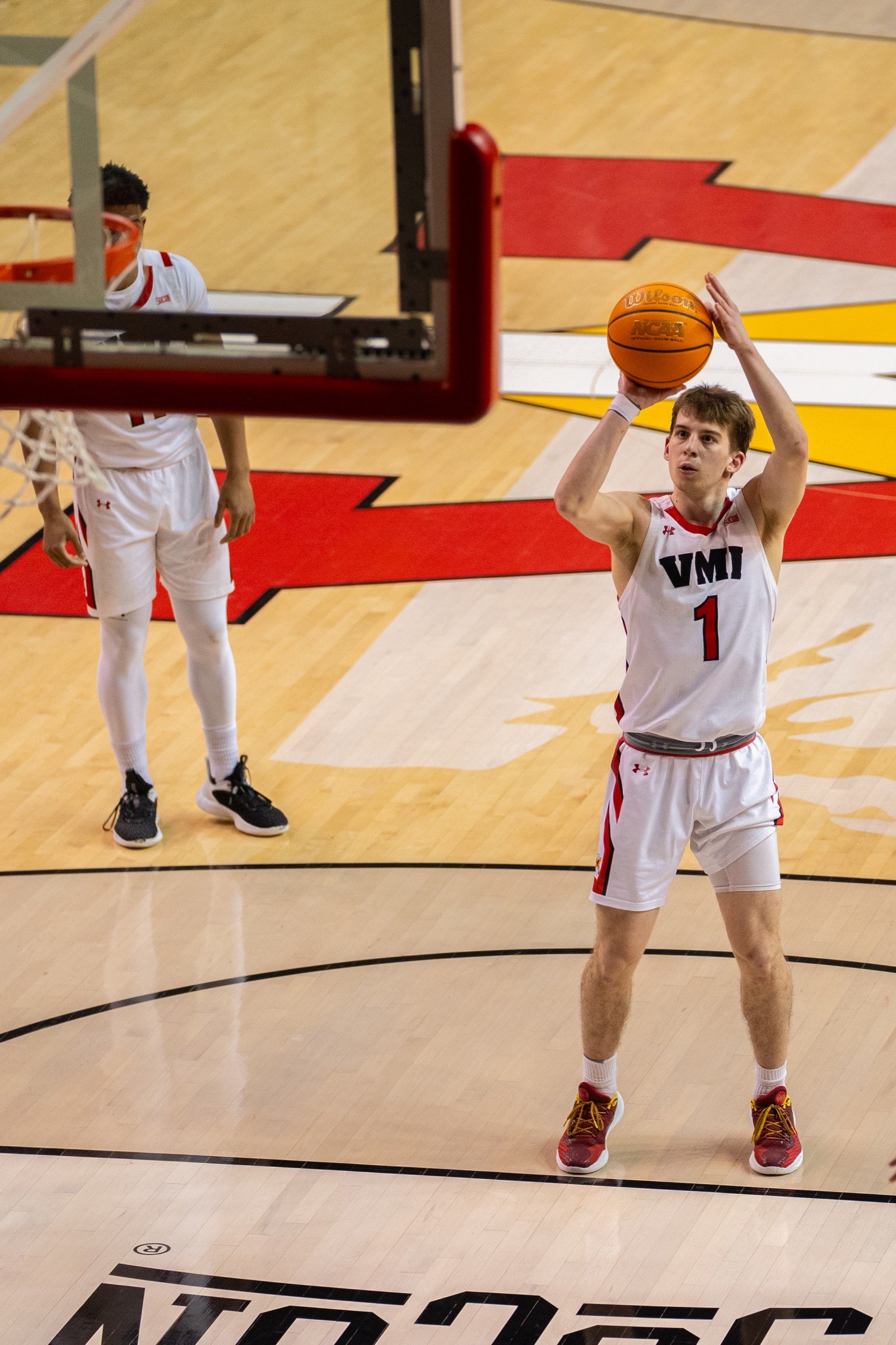 Basketball player reading the defense with the ball in both hands